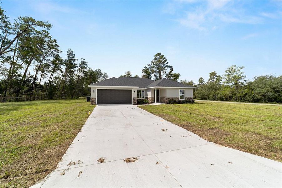 Front exterior of a new home in , Silver Springs, FL, highlighting curb appeal (Image 20).