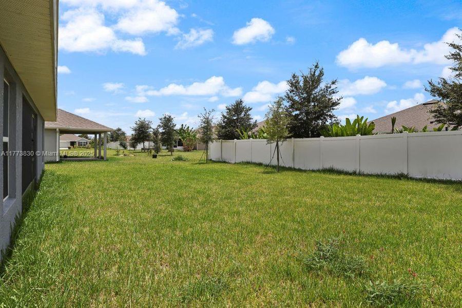 Front exterior of a new home in Waterstone 62, Fort Pierce, FL, highlighting curb appeal (Image 20).