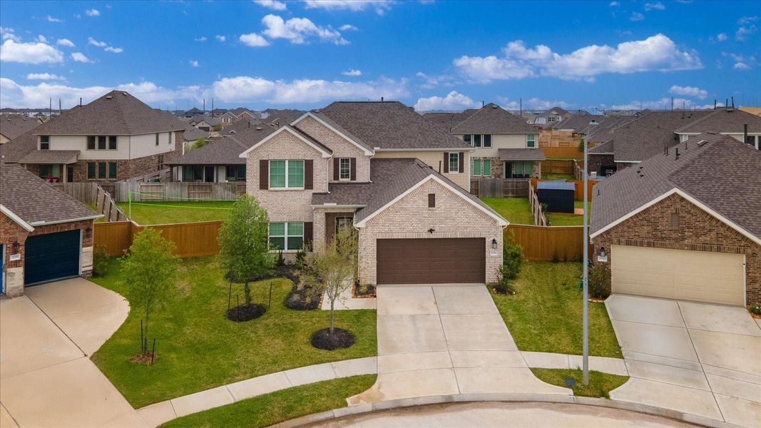 Front exterior of a new home in Marvida, Cypress, TX, highlighting curb appeal (Image 26).