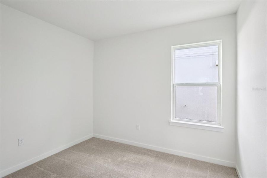 Spacious, unfurnished interior of a new home in Grasslands West, Lakeland (Image 21).