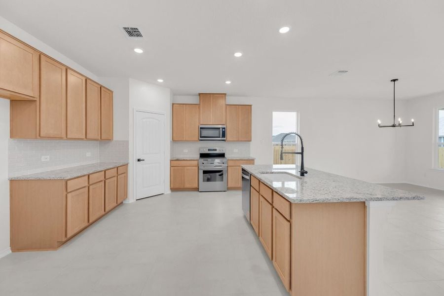 Furnished interior view inside a new home in Mustang Valley, Manor (Image 4).