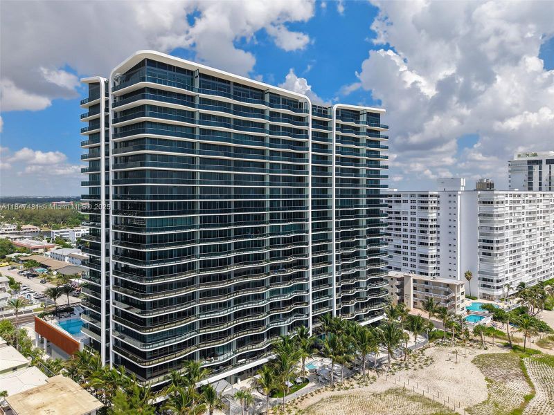 Front exterior of a new home in Casamar, Pompano Beach, FL, highlighting curb appeal (Image 26). Front exterior of a new home in Casamar, Pompano Beach, FL, highlighting curb appeal (Image 26).