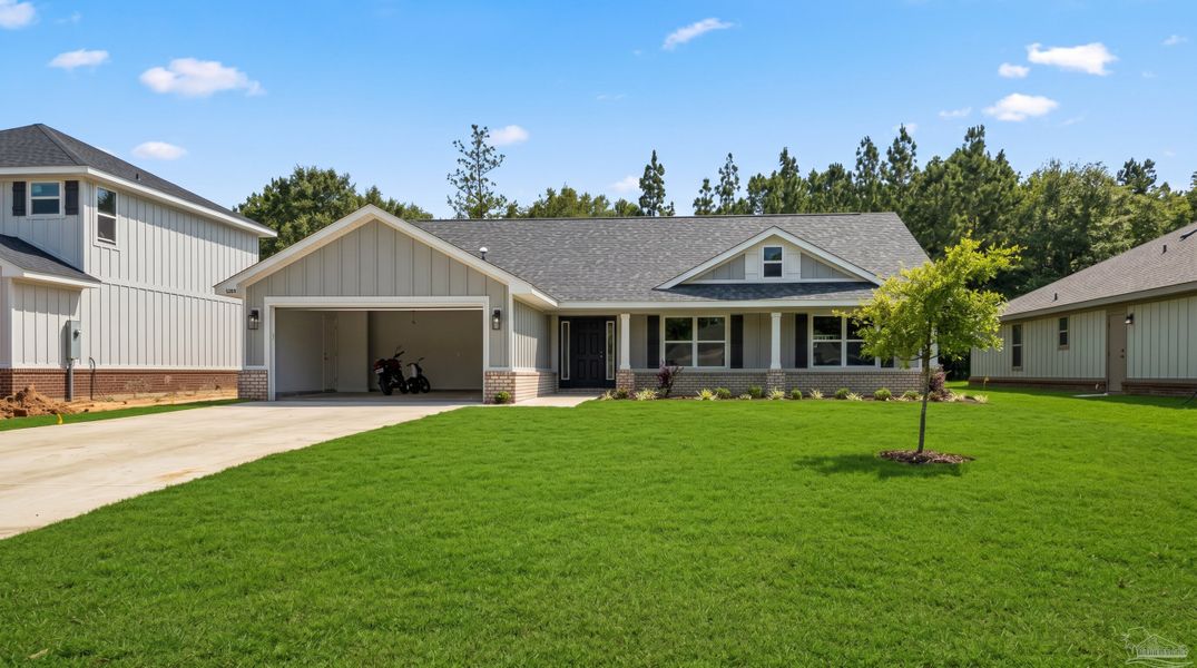Front exterior of a new home in Blossom Grove, Milton, FL, highlighting curb appeal (Image 1). Front exterior of a new home in Blossom Grove, Milton, FL, highlighting curb appeal (Image 1).