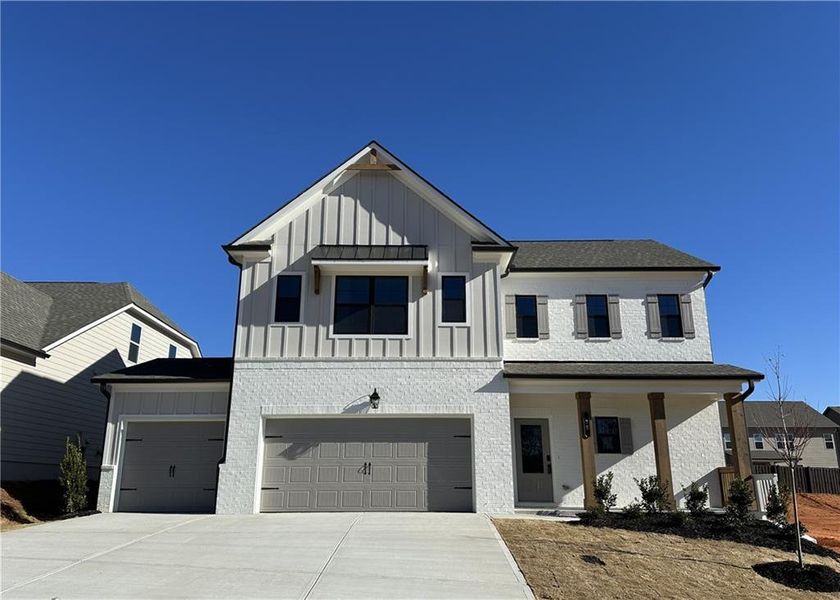 Front exterior of a new home in Summerlin, Winder, GA, highlighting curb appeal (Image 11). Front exterior of a new home in Summerlin, Winder, GA, highlighting curb appeal (Image 11).