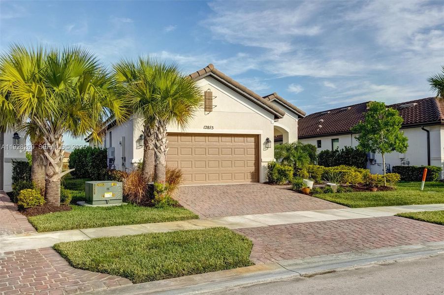 Front exterior of a new home in , Port St. Lucie, FL, highlighting curb appeal (Image 18). Front exterior of a new home in , Port St. Lucie, FL, highlighting curb appeal (Image 18).