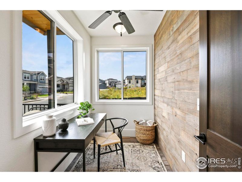 Convenient main floor office with gorgeous wood paneled wall. Creates a nice backdrop for zoom calls.