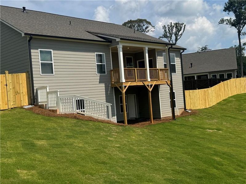 Exterior details and patio area of a home in Rosewood Lake Preserve, Hoschton (Image 20).