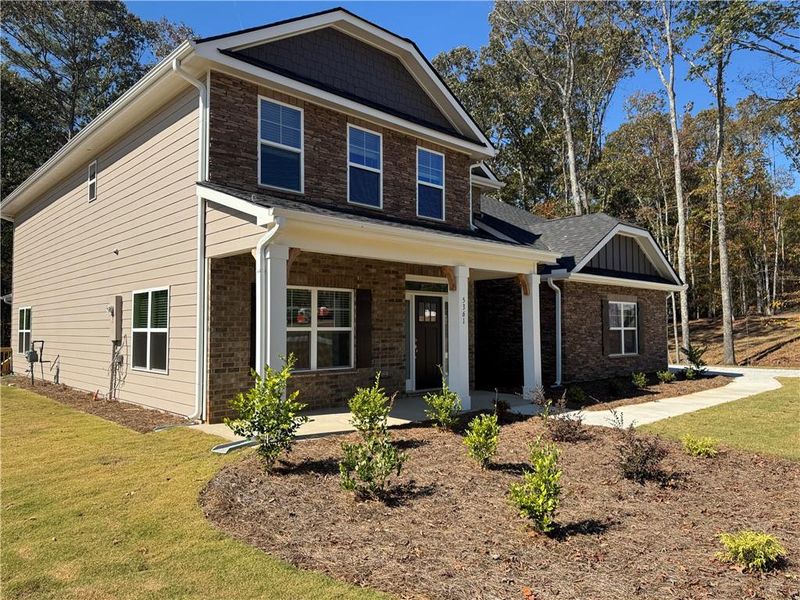 Front exterior of a new home in Tuscany Hills, Douglasville, GA, highlighting curb appeal (Image 1). Front exterior of a new home in Tuscany Hills, Douglasville, GA, highlighting curb appeal (Image 1).