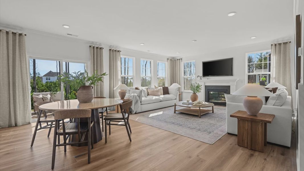 Wynwood home plan open concept family/living room, breakfast area and doors to back patio Wynwood home plan open concept family/living room, breakfast area and doors to back patio