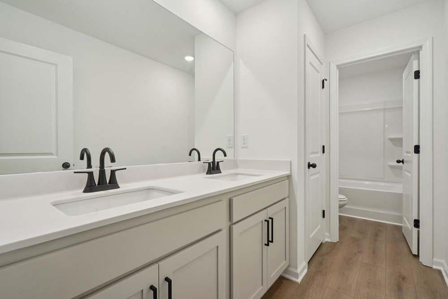 Furnished interior view inside a new home in Eastlyn Crossing, Flowery Branch (Image 6).