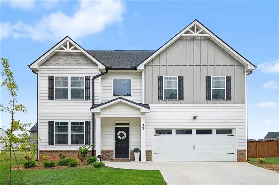 Front exterior of a new home in Preserve at Dove Creek, Statham, GA, highlighting curb appeal (Image 21).