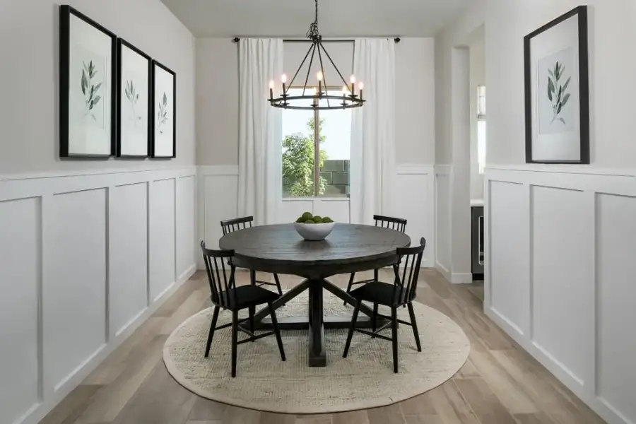 Dining room with passthrough to butler's pantry option. Finishes and options may vary by community