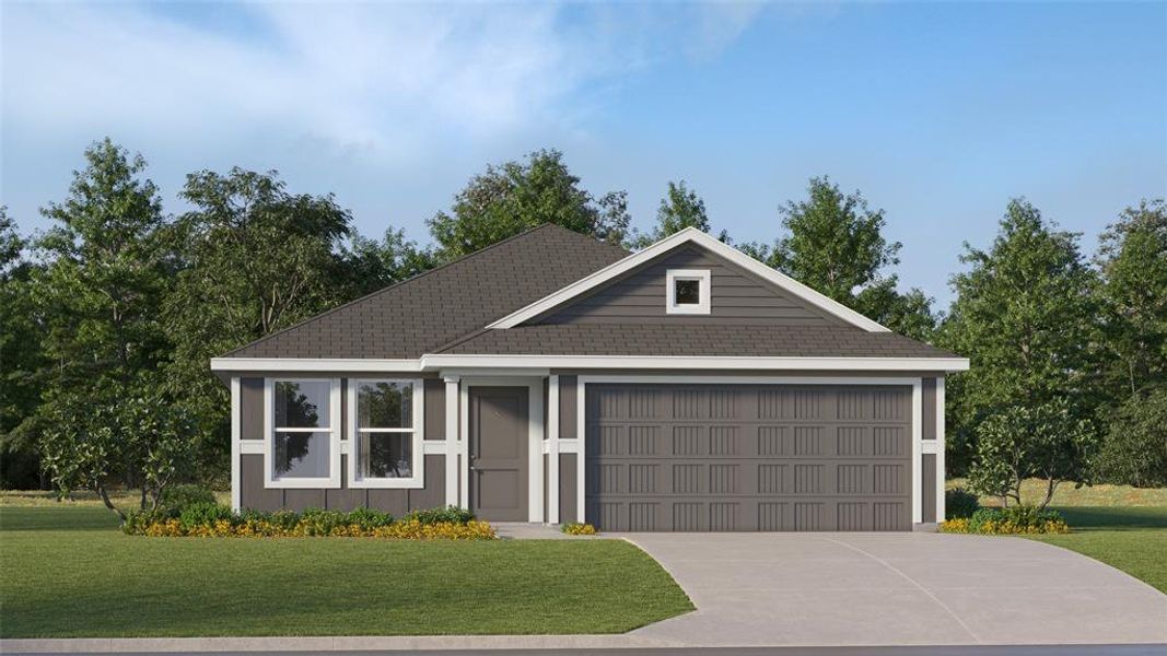 View of front of home featuring a front yard and a garage