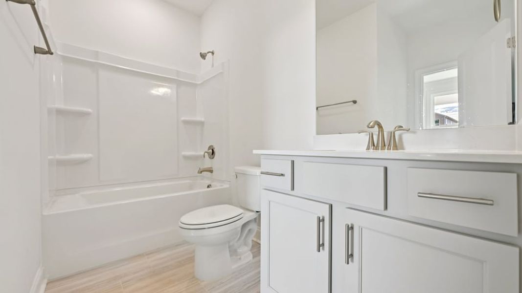 Representative furnished interior of a home built from the Wylie by D.R. Horton in Eagle Creek, Fuquay Varina (Image 7).