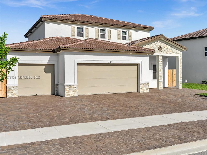 Front exterior of a new home in , Homestead, FL, highlighting curb appeal (Image 26).