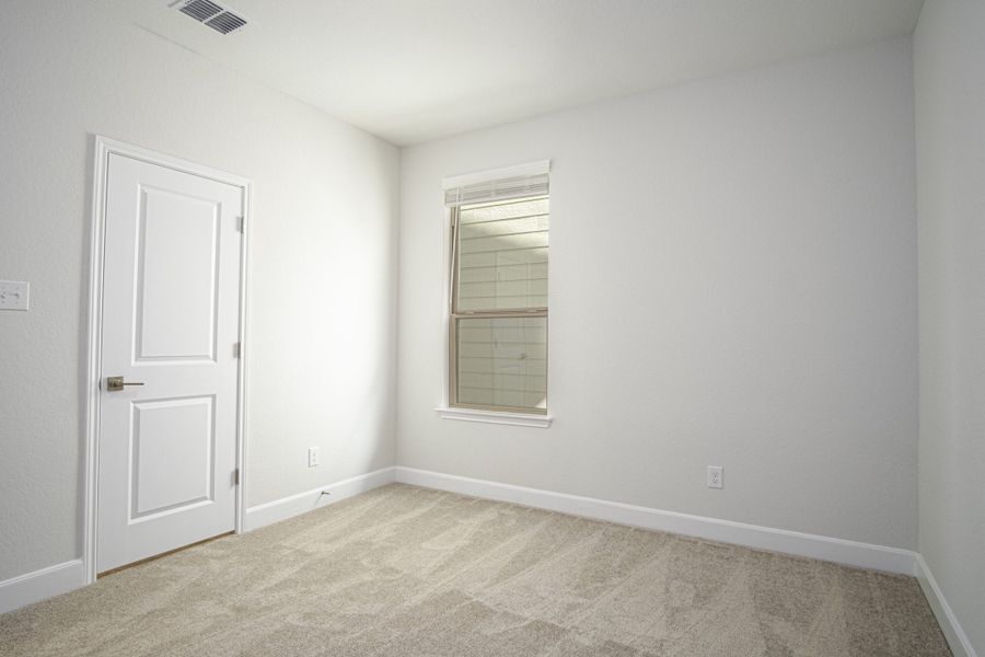 Representative unfurnished interior of a home built from the The Palmer by Rosehaven Homes in Magnolia Village, San Antonio (Image 21).