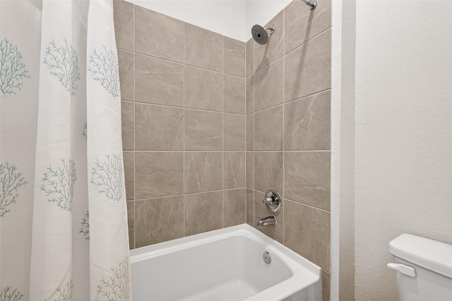 Furnished interior view inside a new home in Mill Creek Trails, Magnolia (Image 41).