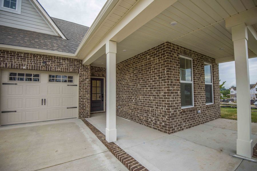 French Country Elevation *Photo of example home. Selections and Finishes May Vary.*