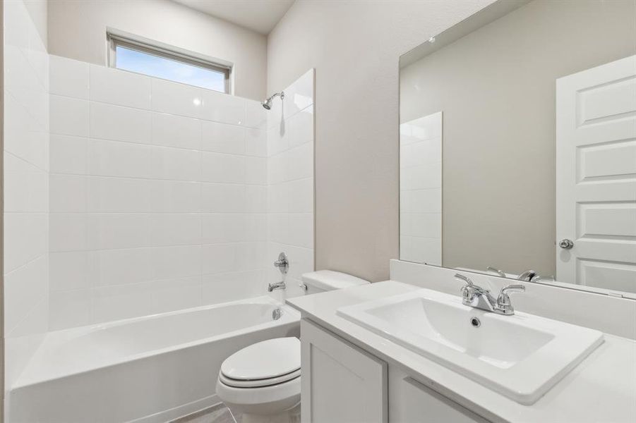 Bathroom in the Elm home plan by Trophy Signature Homes – REPRESENTATIVE PHOTO