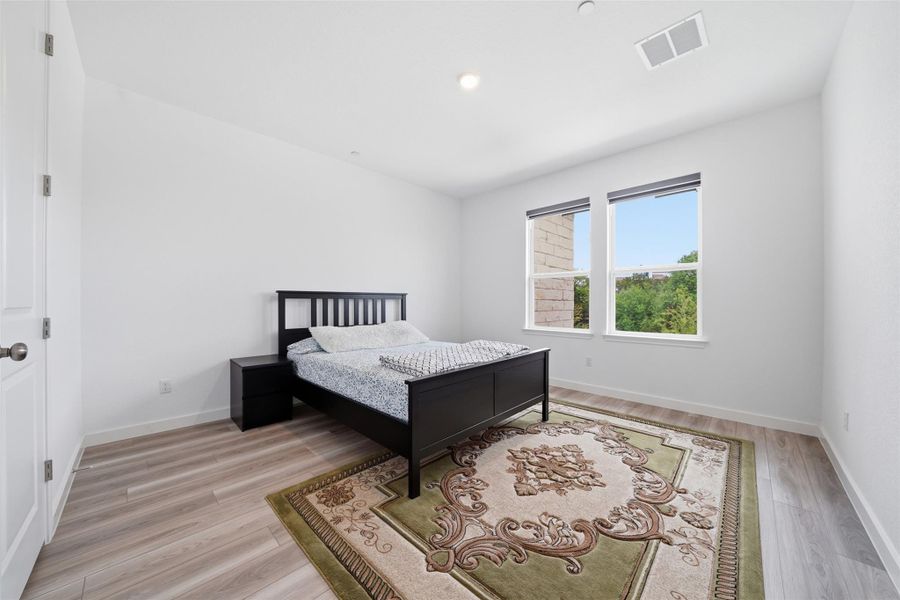 The room features light-colored flooring, white walls, and a recessed ceiling light