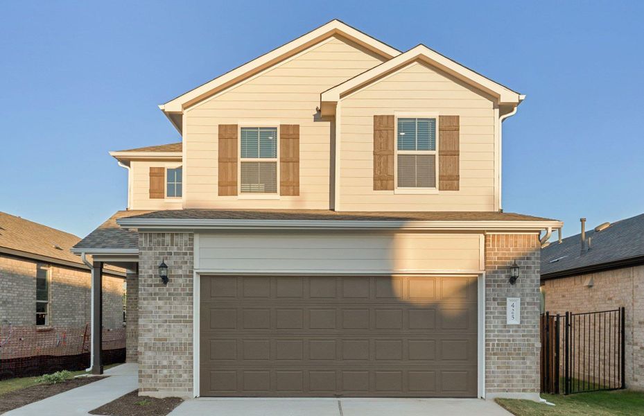 Front exterior of a new home in Saddleback at Santa Rita Ranch, Liberty Hill, TX, highlighting curb appeal (Image 1). Front exterior of a new home in Saddleback at Santa Rita Ranch, Liberty Hill, TX, highlighting curb appeal (Image 1).