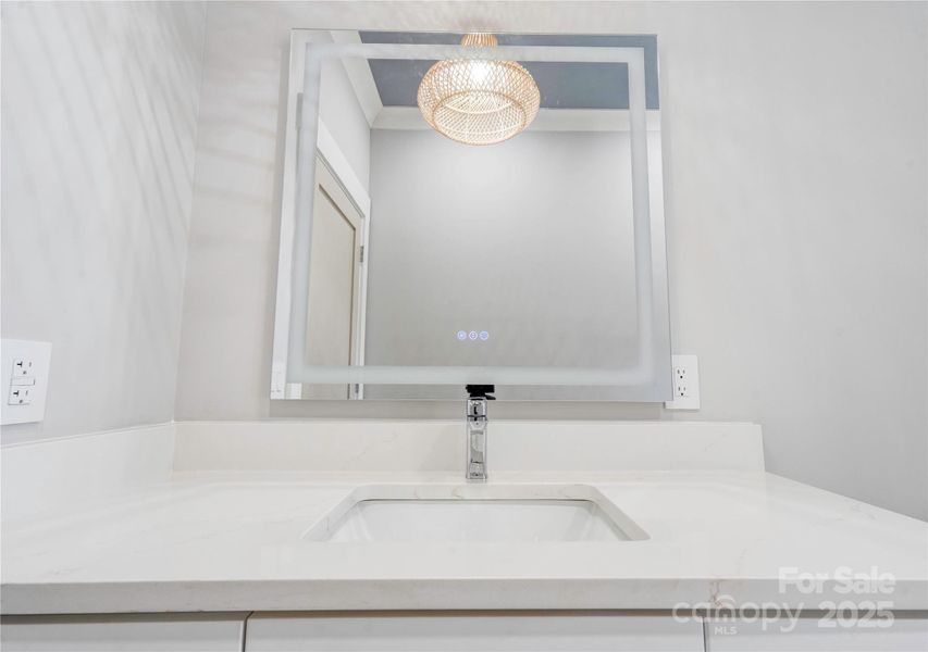 Hall Full Bathroom with fog free mirrors