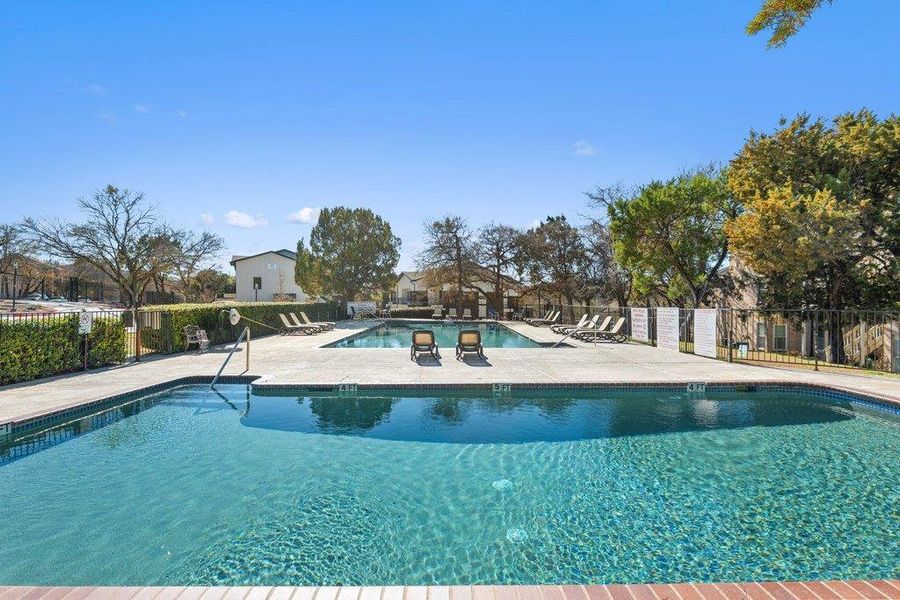 Community pool featuring a patio