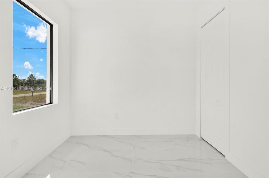 Spacious, unfurnished interior of a new home in , Lehigh Acres (Image 8).