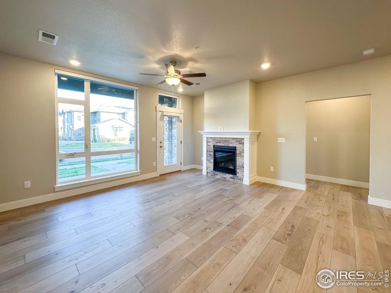 Living Room with gas fireplace-  Photos not of the actual unit. Finishes vary.