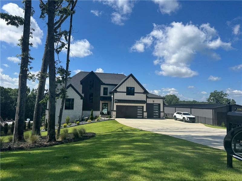 Front exterior of a new home in , Buford, GA, highlighting curb appeal (Image 1). Front exterior of a new home in , Buford, GA, highlighting curb appeal (Image 1).
