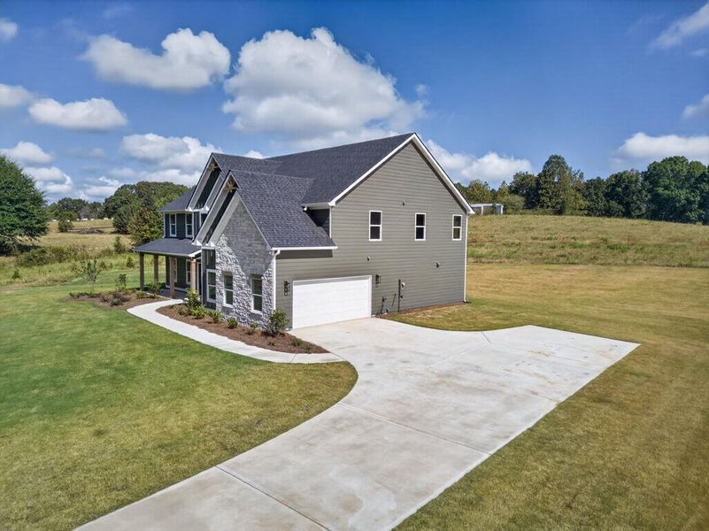 Front exterior of a new home in Blackwelder Bluff, Bowdon, GA, highlighting curb appeal (Image 30).