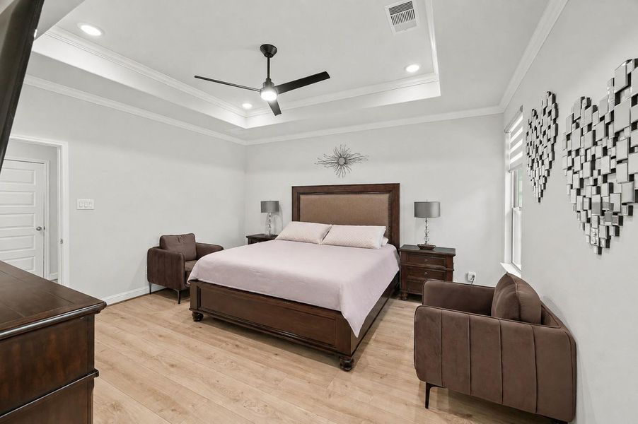 Secondary view of the primary bedroom suite.