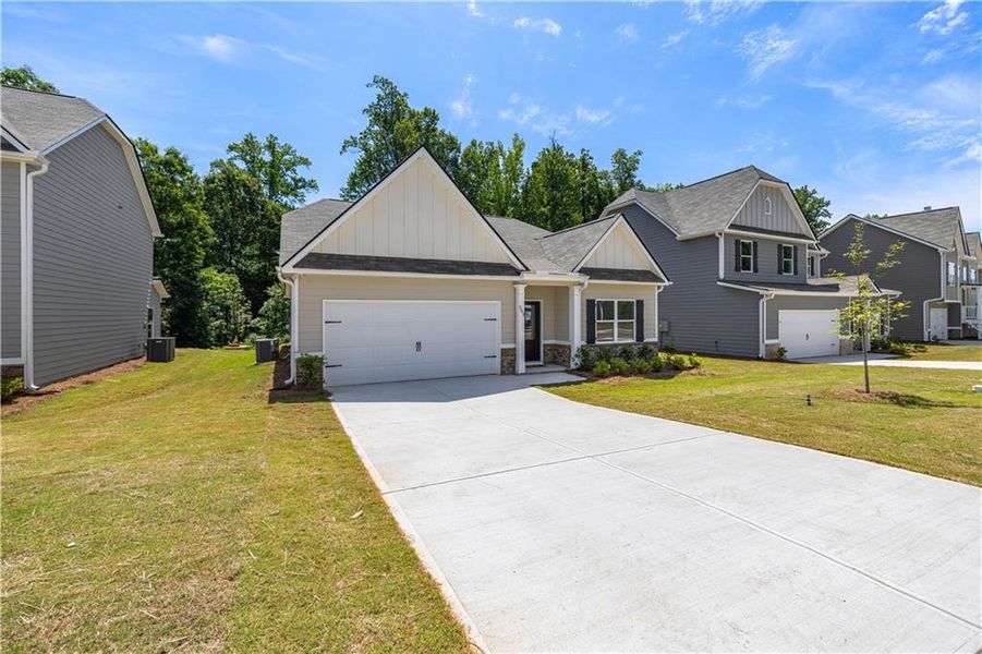 Front exterior of a new home in , Villa Rica, GA, highlighting curb appeal (Image 2). Front exterior of a new home in , Villa Rica, GA, highlighting curb appeal (Image 2).