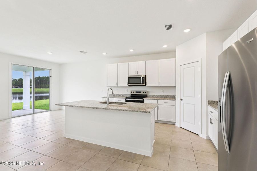 Furnished interior view inside a new home in Lakes at Bella Lago - Signature Series, Green Cove Springs (Image 9).