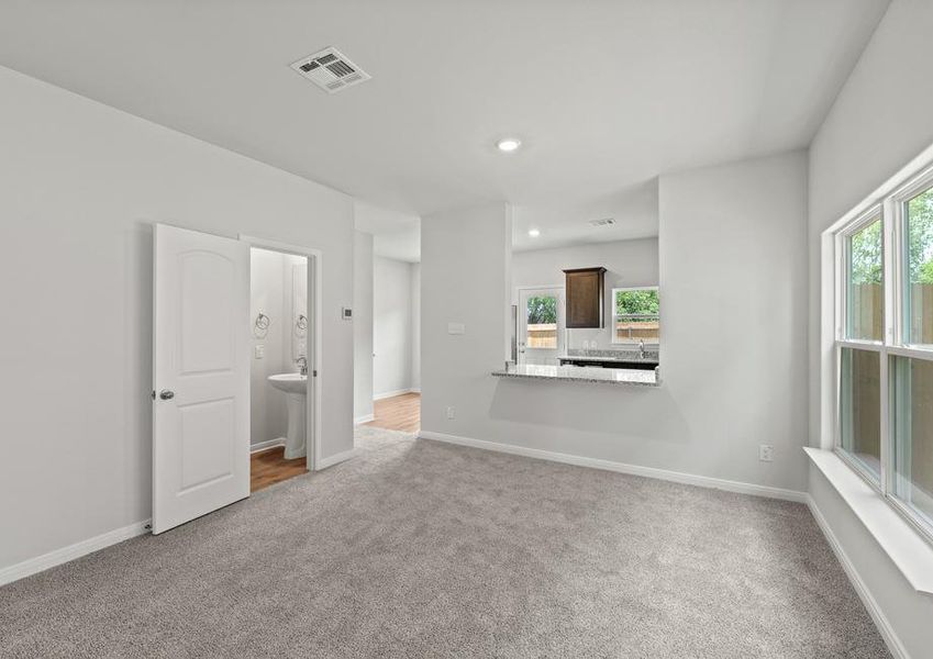 The main floor of the Piper floor plan has wonderful, open living spaces and a powder room.