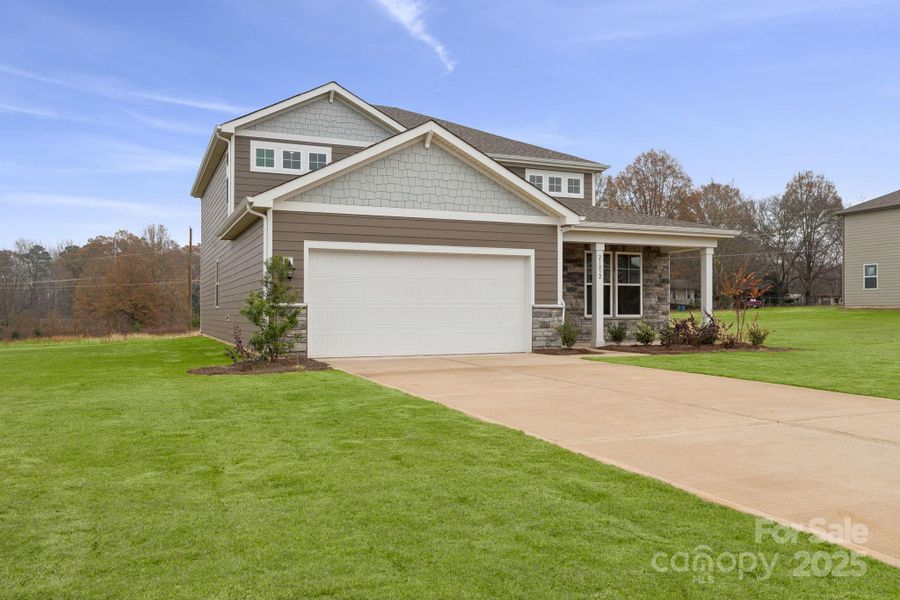 Front exterior of a new home in Running Creek, Locust, NC, highlighting curb appeal (Image 15). Front exterior of a new home in Running Creek, Locust, NC, highlighting curb appeal (Image 15).