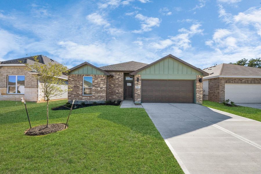 Front exterior of a new home in Grand Oaks Reserve, Cleveland, TX, highlighting curb appeal (Image 24). Front exterior of a new home in Grand Oaks Reserve, Cleveland, TX, highlighting curb appeal (Image 24).