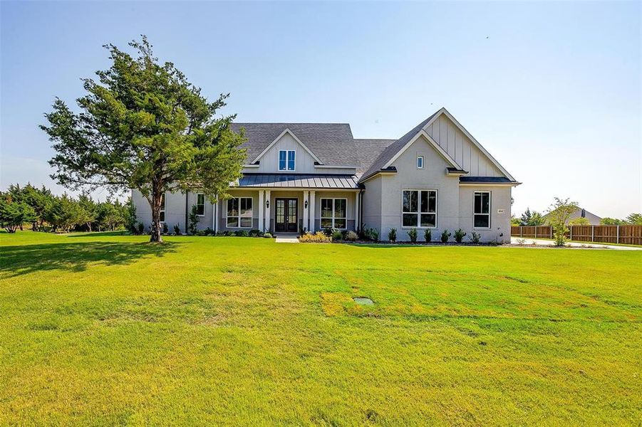 View of front of property with a front yard