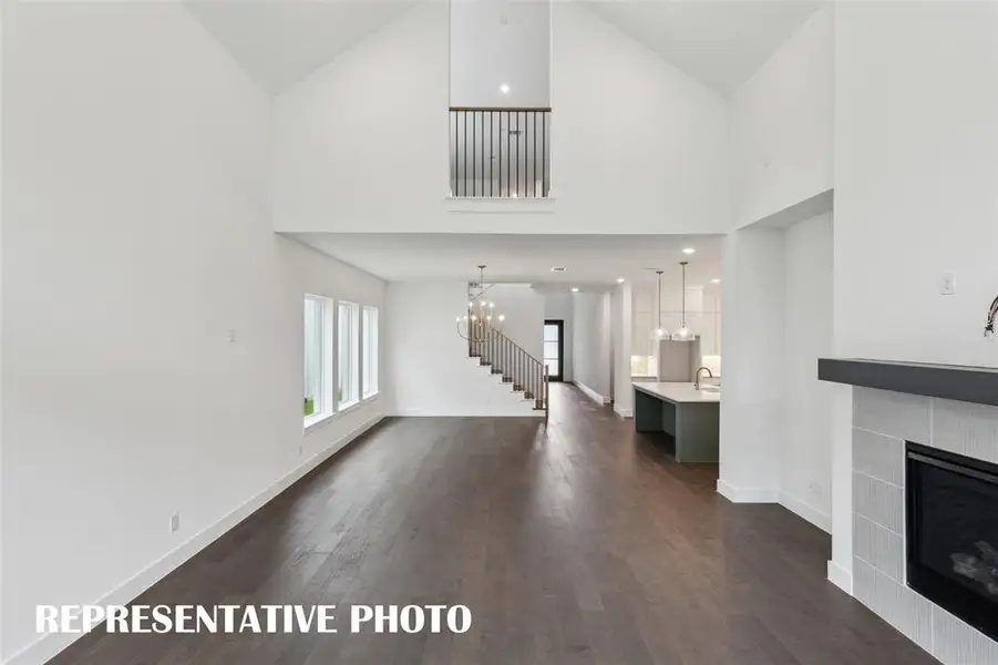 With sight lines from the front to the back of the home and an upstairs overlook, the entire family will love this over the top home!  REPRESENTATIVE PHOTO