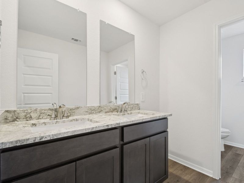 Furnished interior view inside a new home in Riverbend at Double Eagle - Boulevard Collection, Cedar Creek (Image 5).