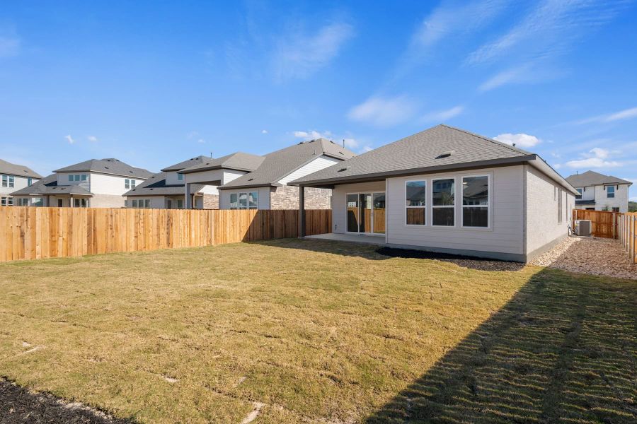 Exterior details and patio area of a home in Heritage, Dripping Springs (Image 25).