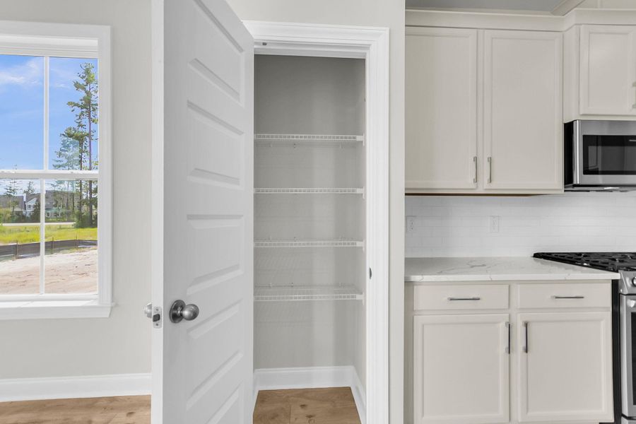 Furnished interior view inside a new home in Tidewater at Lakes of Cane Bay, Summerville (Image 9).
