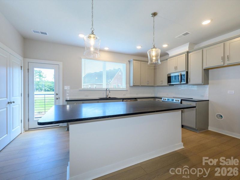 Furnished interior view inside a new home in Central Living at Craig, Charlotte (Image 7).