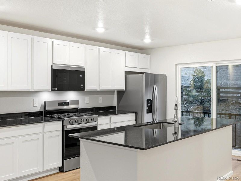 Furnished interior view inside a new home in Three Hills, Morrison (Image 10).