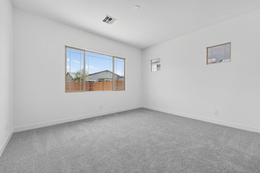 Spacious, unfurnished interior of a new home in Ellsworth Ranch, Queen Creek (Image 22).