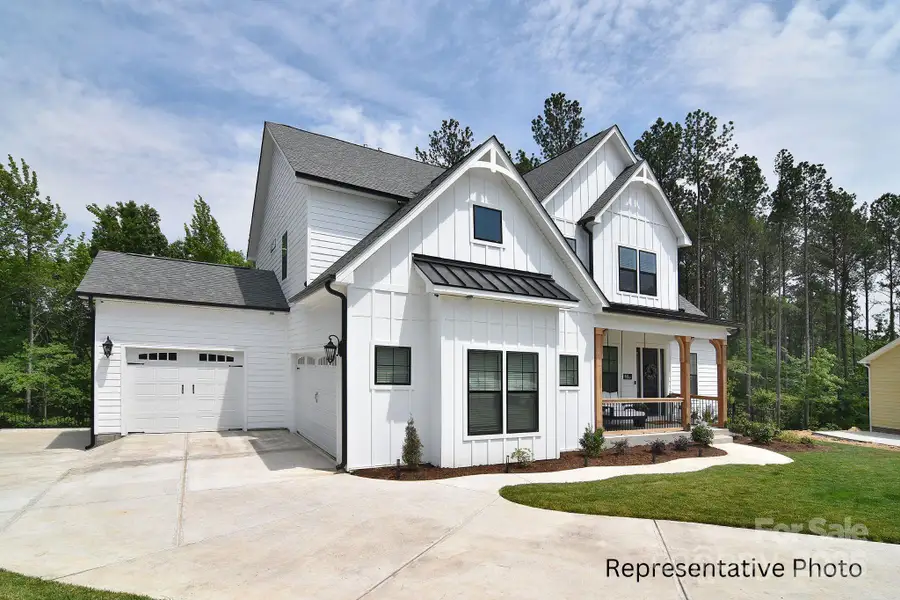 Front exterior of a new home in , Mooresville, NC, highlighting curb appeal (Image 1).