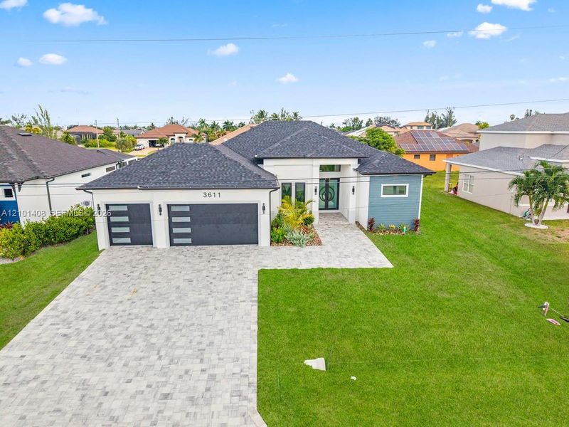 Front exterior of a new home in , Cape Coral, FL, highlighting curb appeal (Image 26).