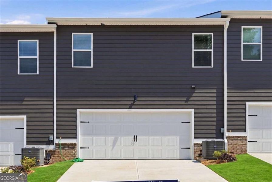 Front exterior of a new home in Parkway James, Snellville, GA, highlighting curb appeal (Image 18).