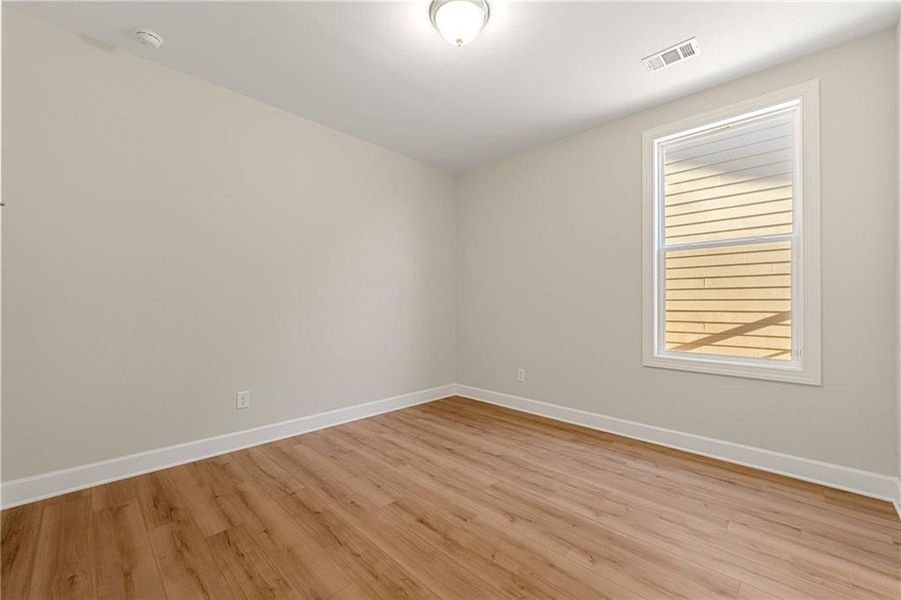 Spacious, unfurnished interior of a new home in Cresswind Georgia at Twin Lakes, Hoschton (Image 23).