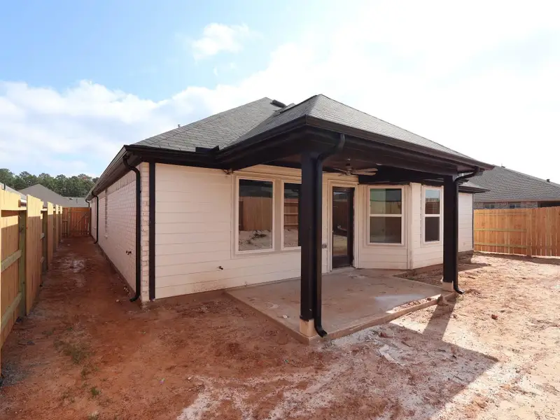 Exterior details and patio area of a home in Magnolia Ridge, Magnolia (Image 4). Exterior details and patio area of a home in Magnolia Ridge, Magnolia (Image 4).
